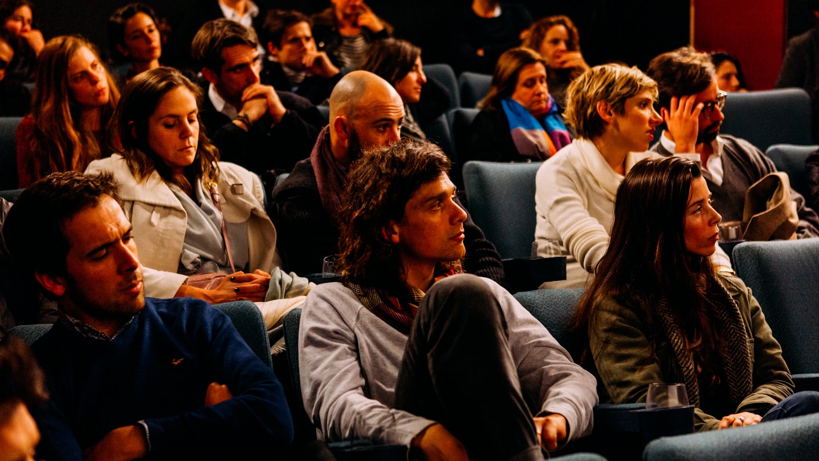 Students engaged in a classroom session with laptops and notes